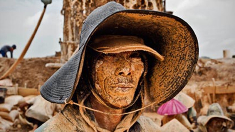 A tin miner in Bangka, Indonesia